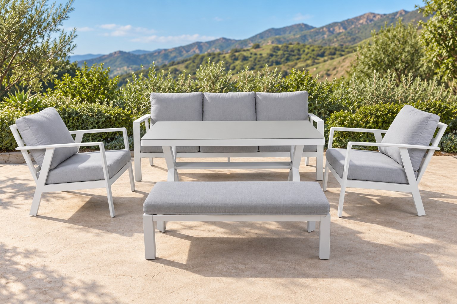 Geneva 5 Piece Set with white frames and grey cushions on a sunlit garden patio