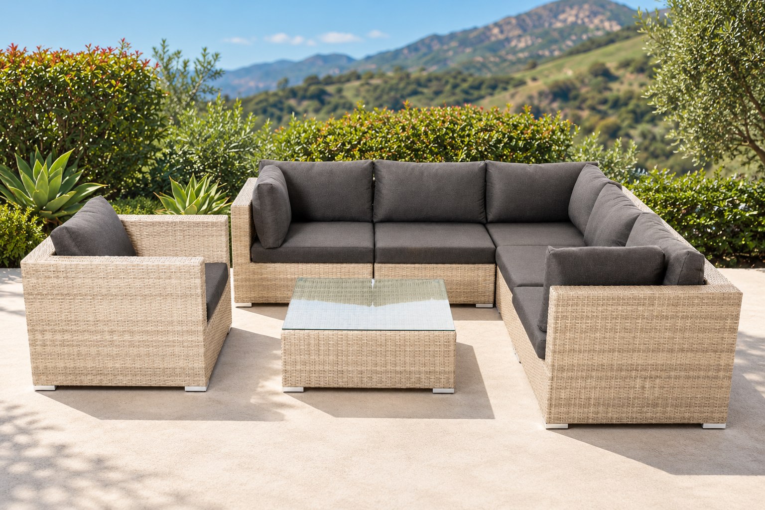 Sumatra 5 Piece Sectional with charcoal cushions on a sunlit garden patio